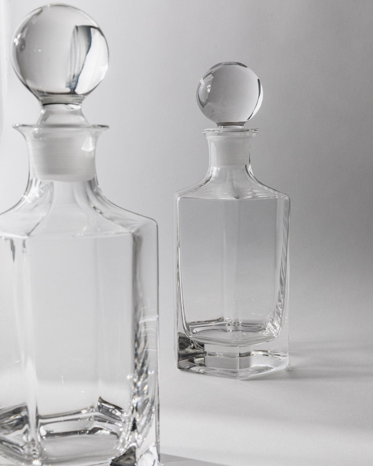 1970s Glass Decanter Set of 2 — top view of clear glass decanters