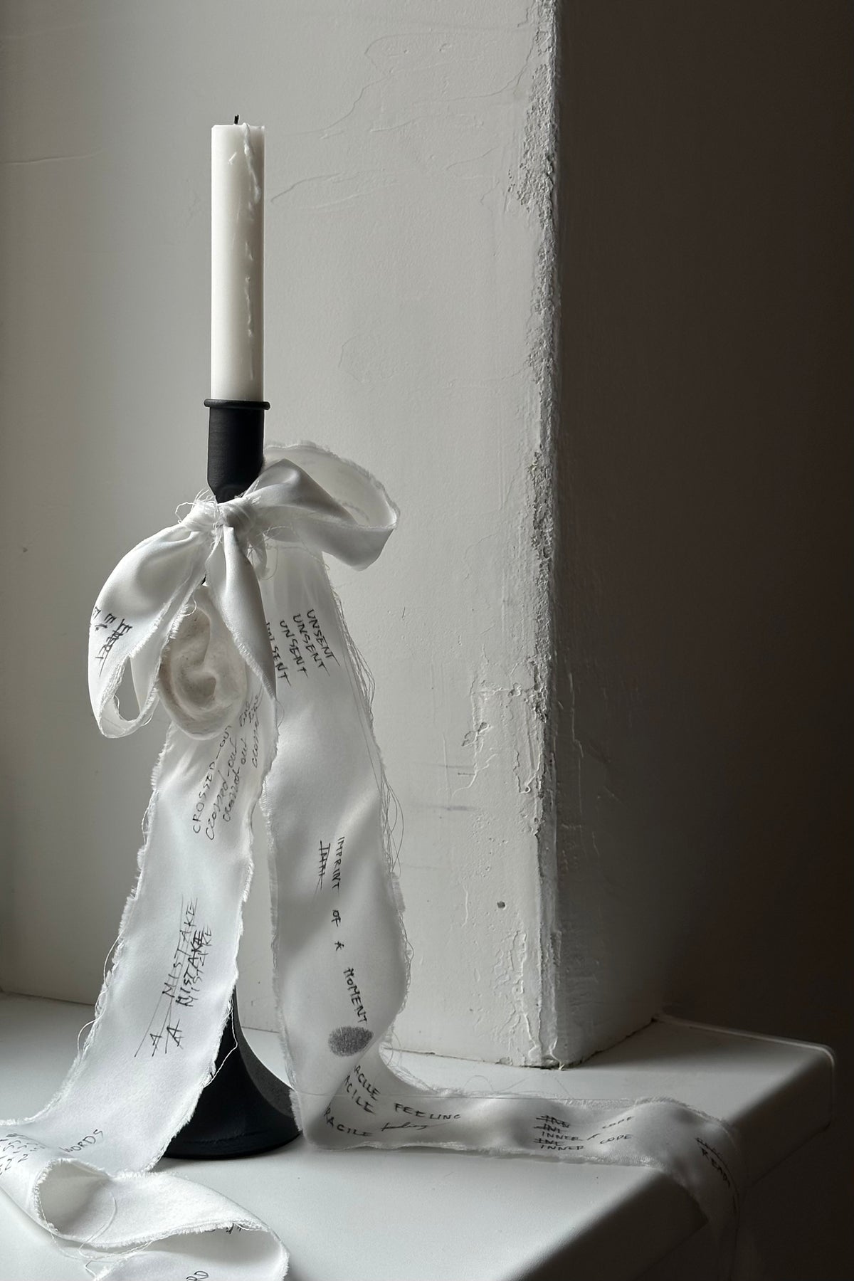 'UNSENT EAR' candleholder — lifestyle setting