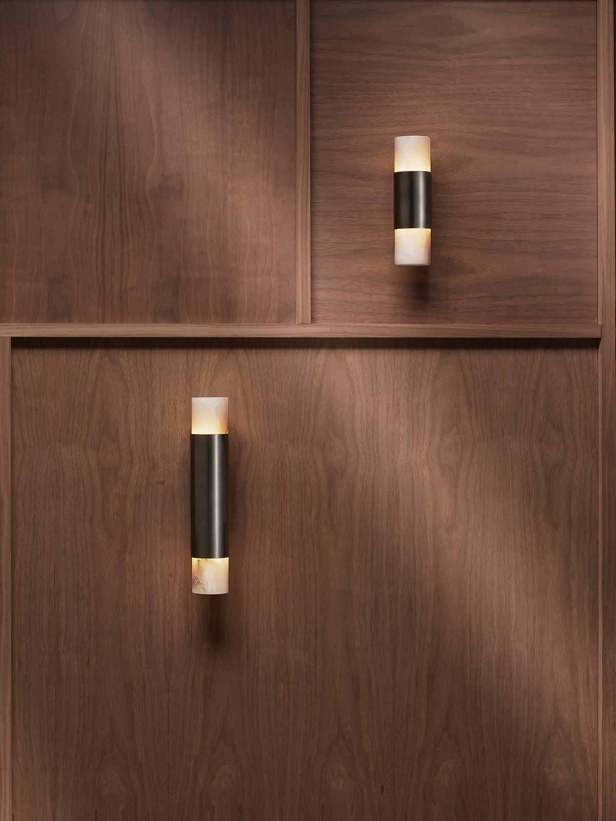 ROMA Wall Tall — top view of black and white wall light on wood panel