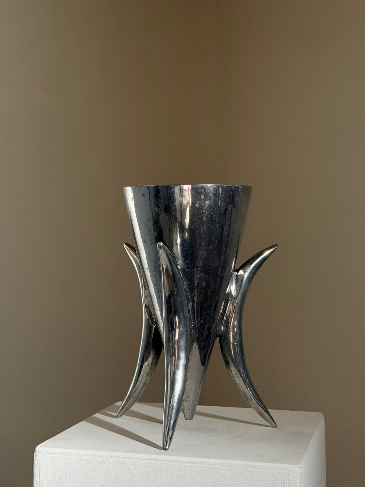 Large cast aluminum tripod vase, France, 1970 — detail view