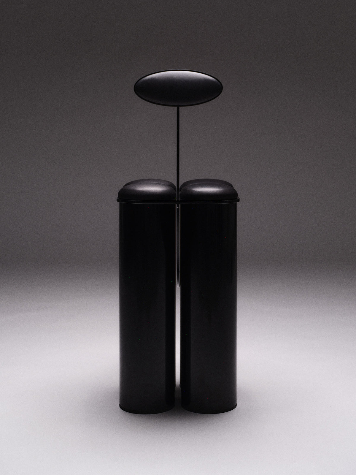Giulio Stool — front view of black cylindrical design