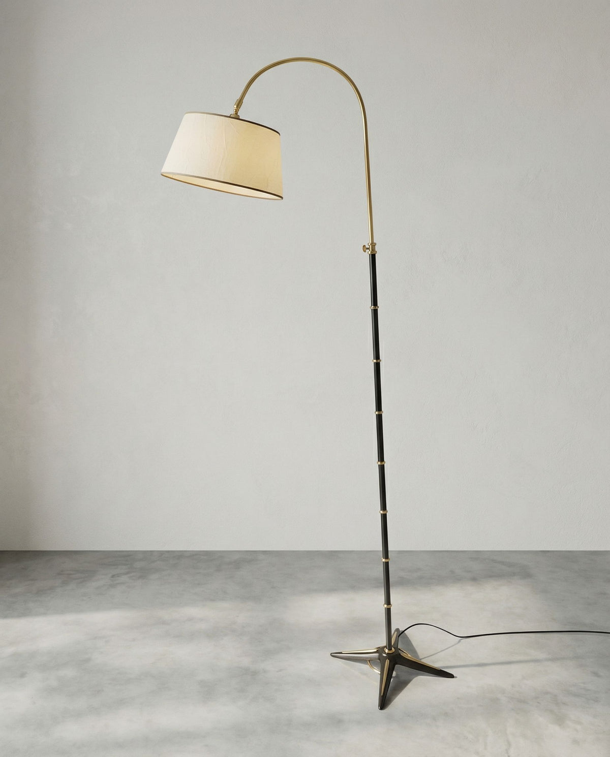 Neoclassical floor lamp by Gilles Sermadiras for the Maison & Jardin — side angle showing black and brass materials