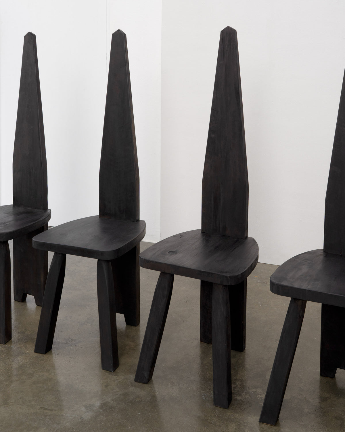 Brutalist High Back Chair — side angle showing dark wood finish