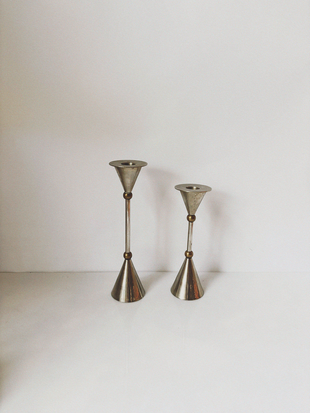 Postmodern Metal and Brass Candleholders — side angle showing polished metal finish