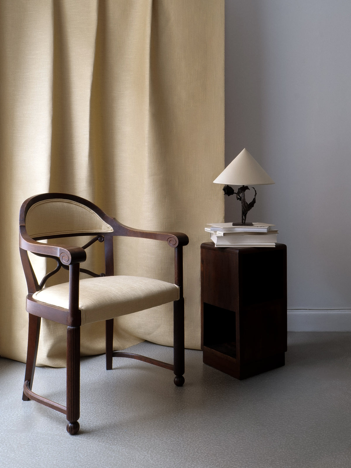 Art Deco side table styled with upholstered chair and lamp