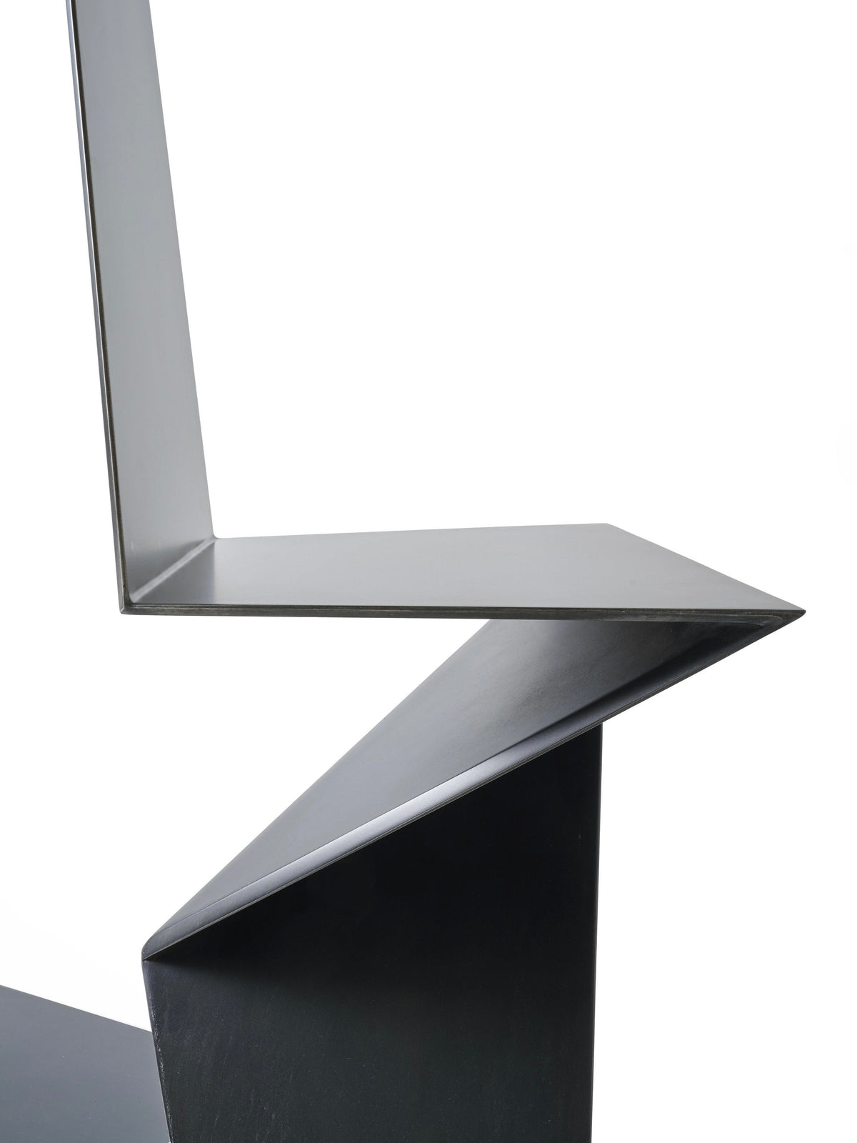 DARK SIDE chair in metal, aluminum and black patina — back view highlighting angular design