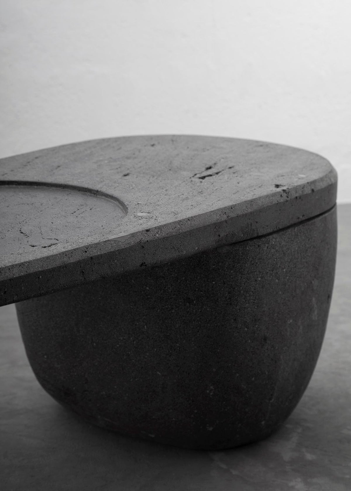 CENTRO Coffee Table Handcarved Volcanic Stone — lifestyle setting