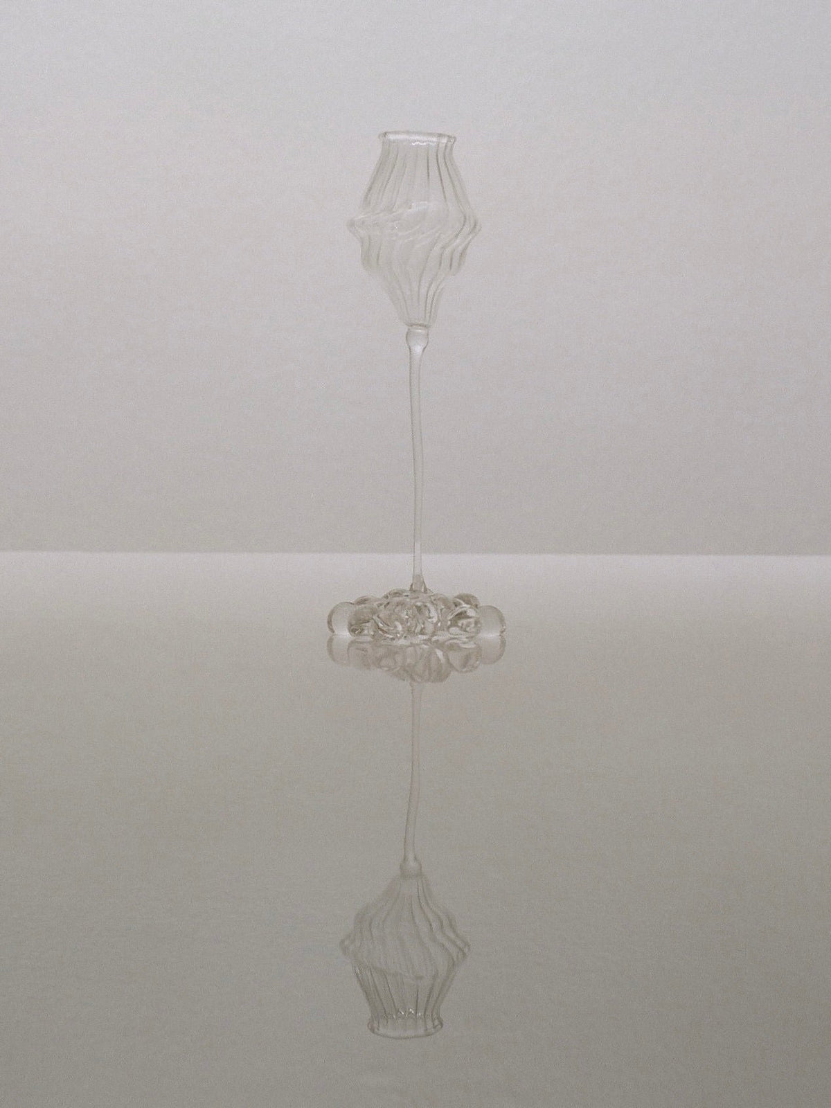 Orphée Liqueur Glasses – Mouth-Blown Set of 2 — side angle on reflective surface