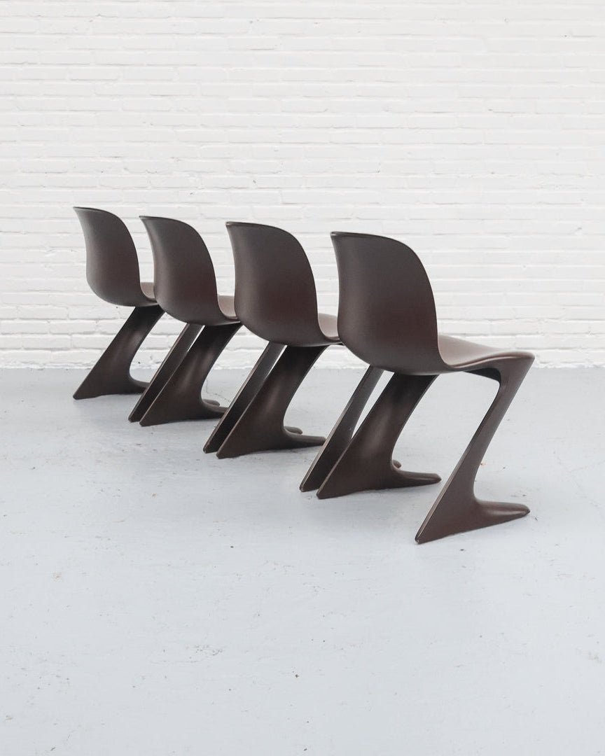 Four brown Ernst Moeckl Z chairs arranged in row, cantilever design