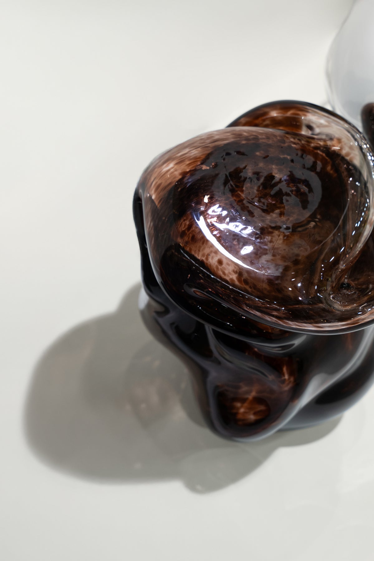 Wave Stool / Side Table I — top view of glossy brown resin surface