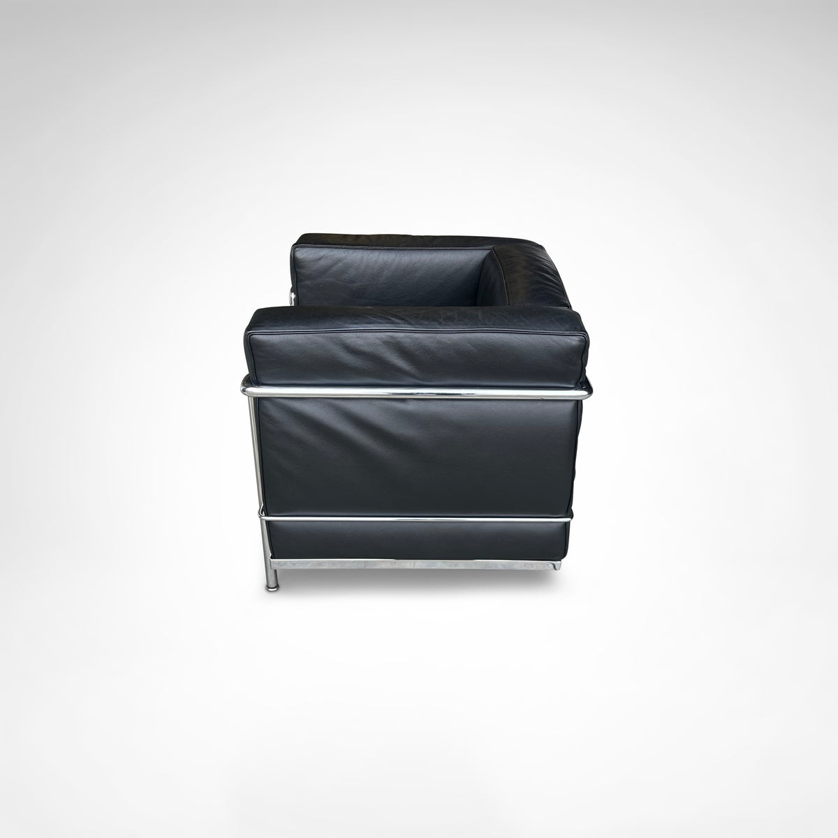 LC2 Armchair and Ottoman by Le Corbusier et al. for Cassina 1990s — rear view highlighting black leather upholstery