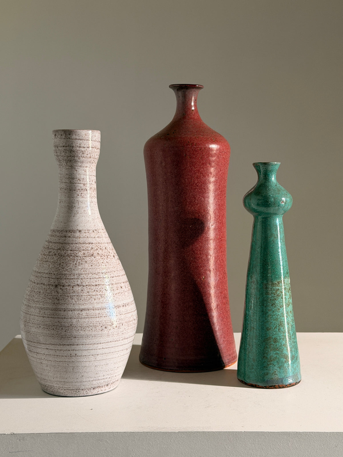 Elegant green glazed terracotta soliflore vase, circa 1960 — close-up