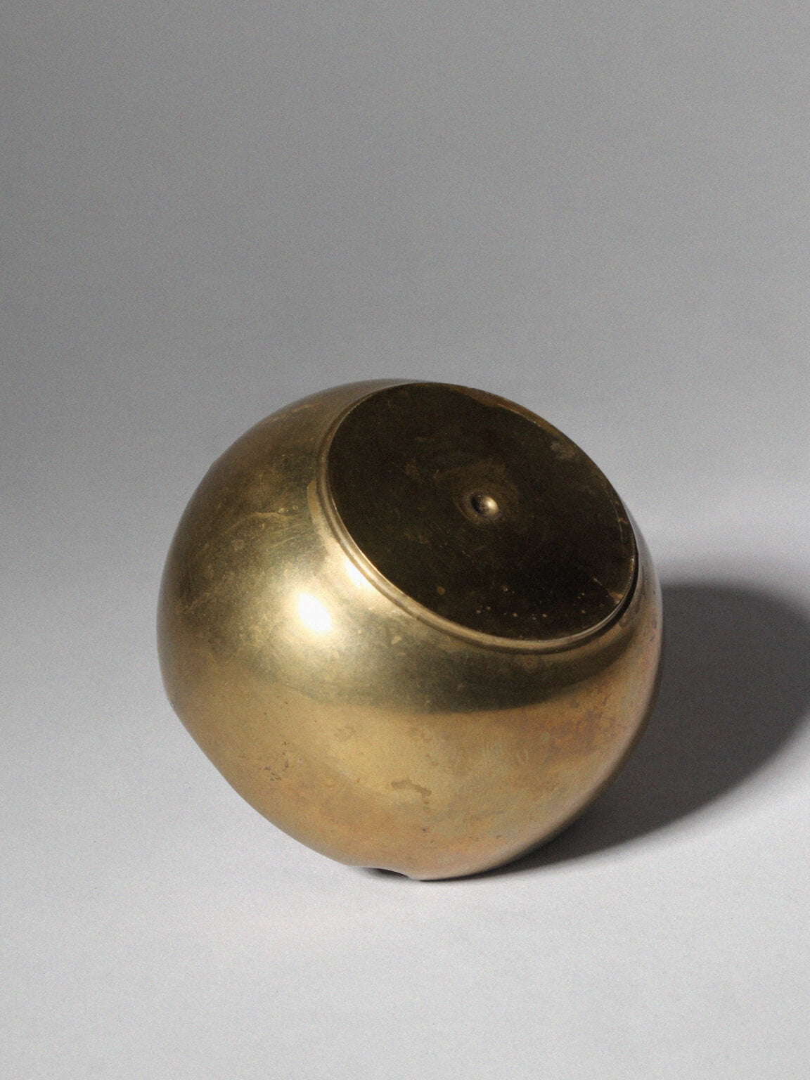 Modernist Spherical Brass Ashtray — lifestyle setting