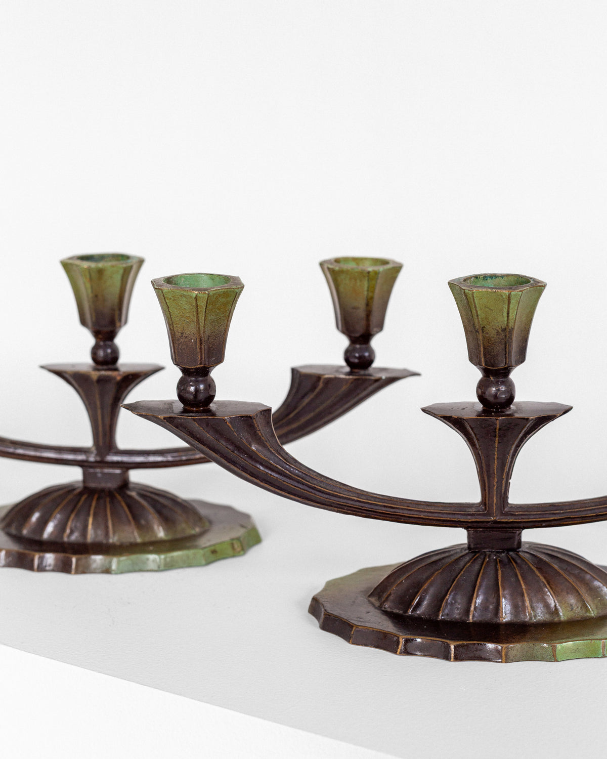 Art Deco bronze candlesticks detail view showing patina finish