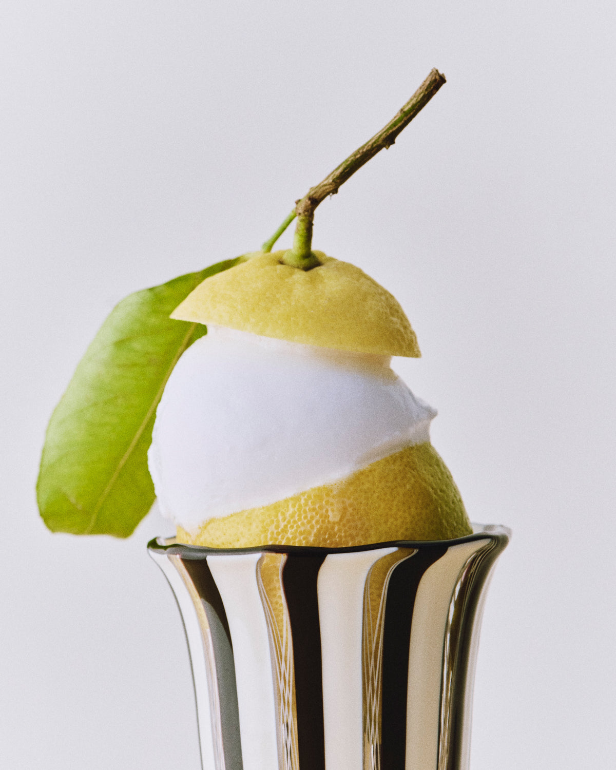 Clara Glasses - Set of four — side angle with lemon sorbet inside