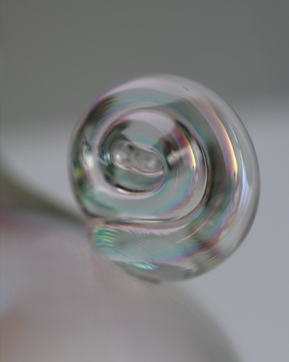 Iridescent rainbow crystal vase showing swirled glass detail
