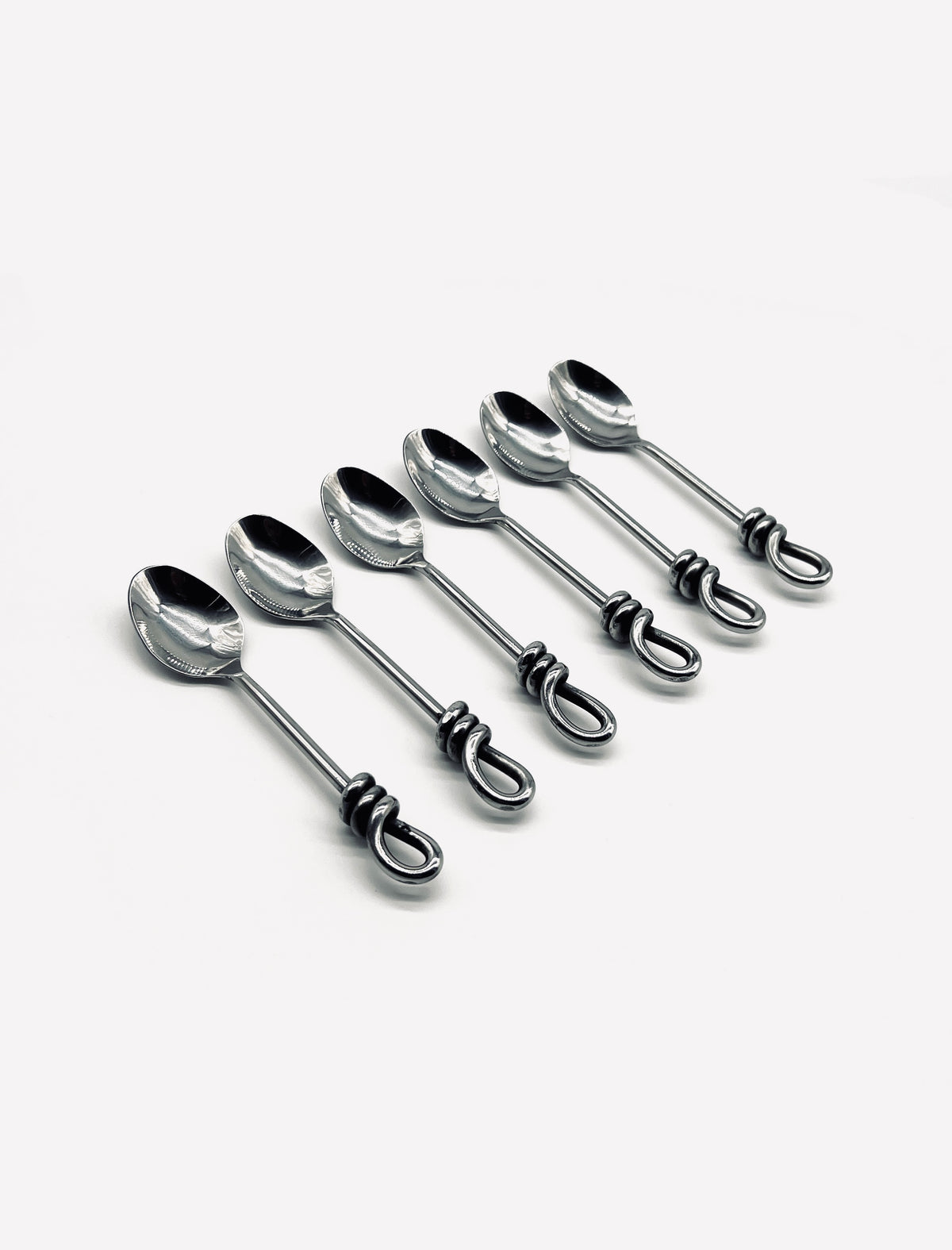 Six vintage stainless steel moka spoons with decorative twisted handles