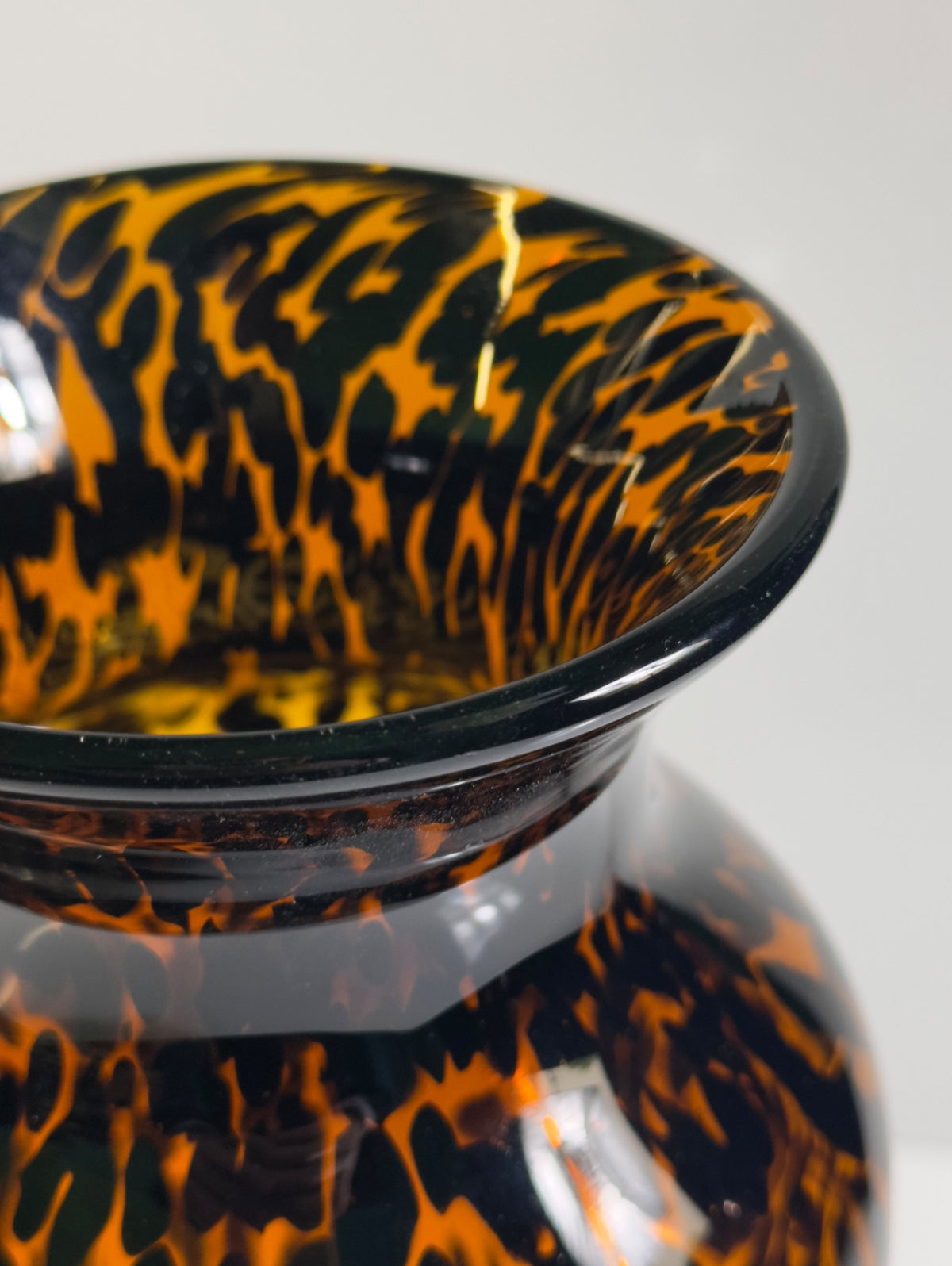 Close-up detail of Murano tortoise glass vase swirled pattern