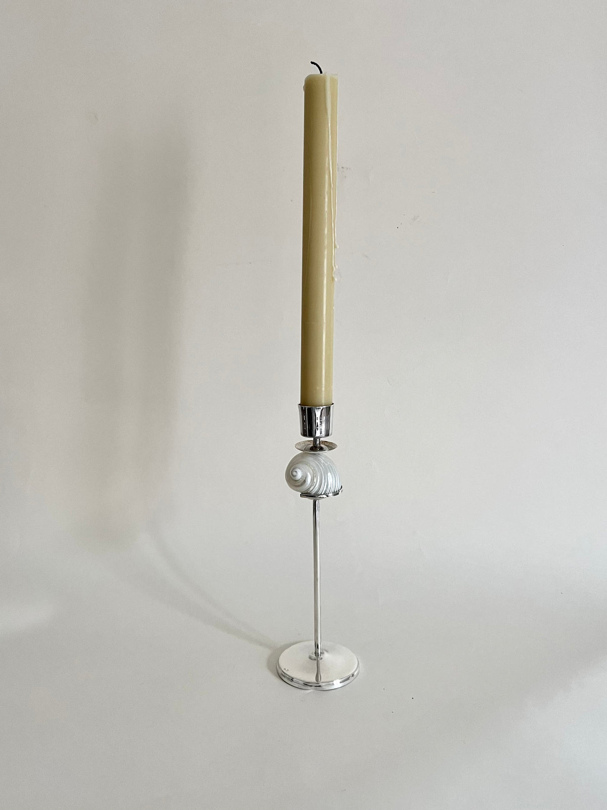 Silver Spiral Candleholder — front view with pale yellow candle