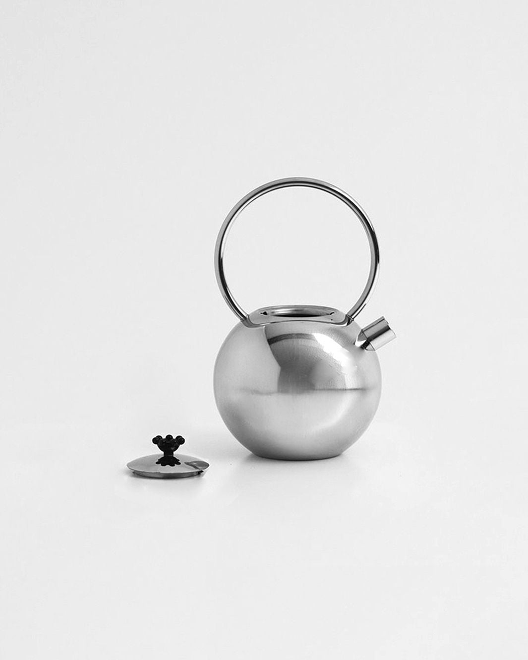 Chrome teapot by Matteo Thun for WMF — side angle showing polished chrome finish