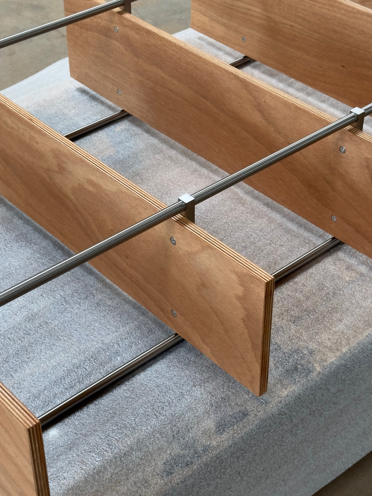 Spaghetti Shelf System — side angle showing wooden shelves and metal supports