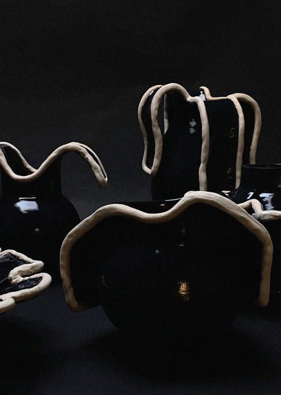 Navy blue ceramic vase with sculptural white clay tentacles detail