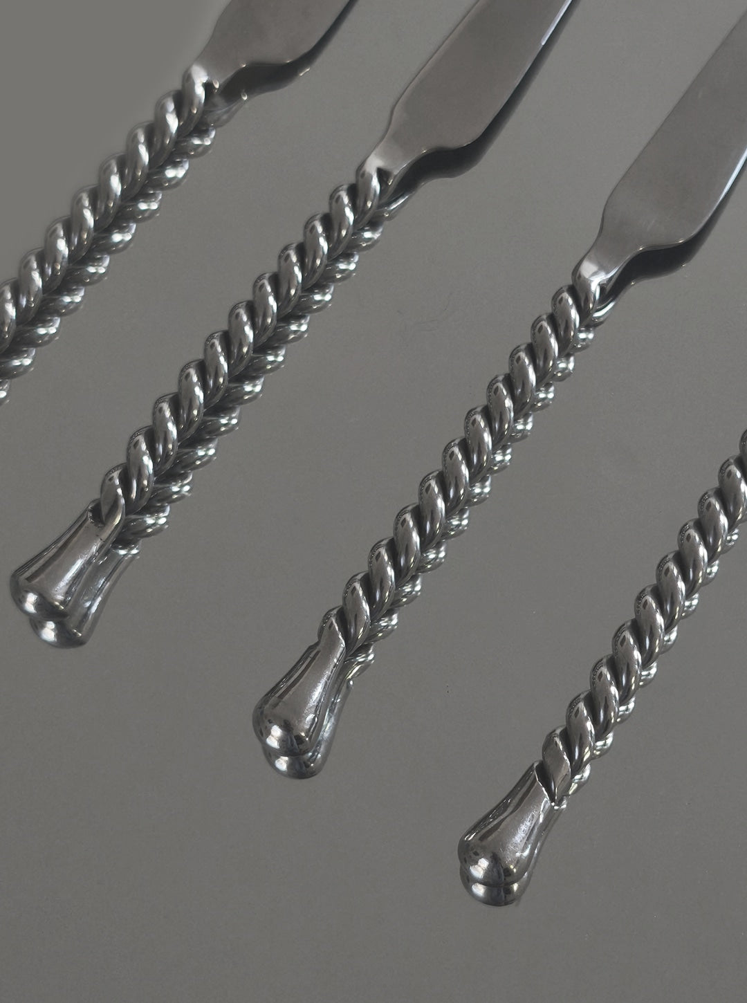 Twisted silver handles detail of luxury cheese knife set