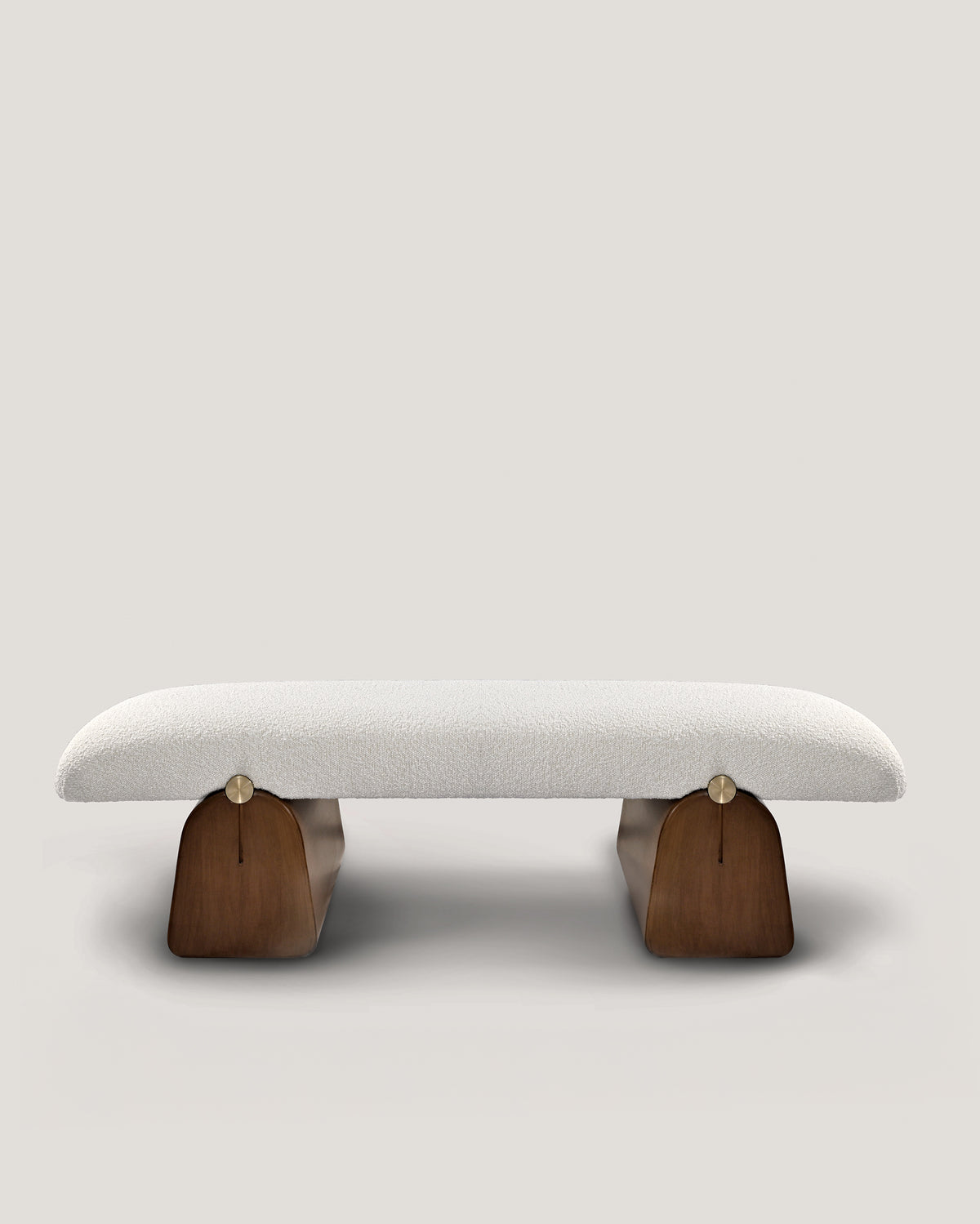 Modern upholstered bench with curved wooden base by Buket Hoscan