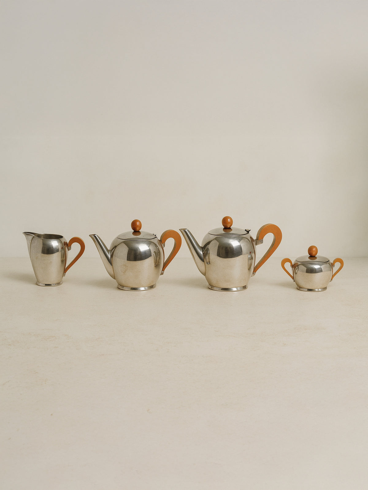 Art Deco stainless steel tea coffee set with orange handles