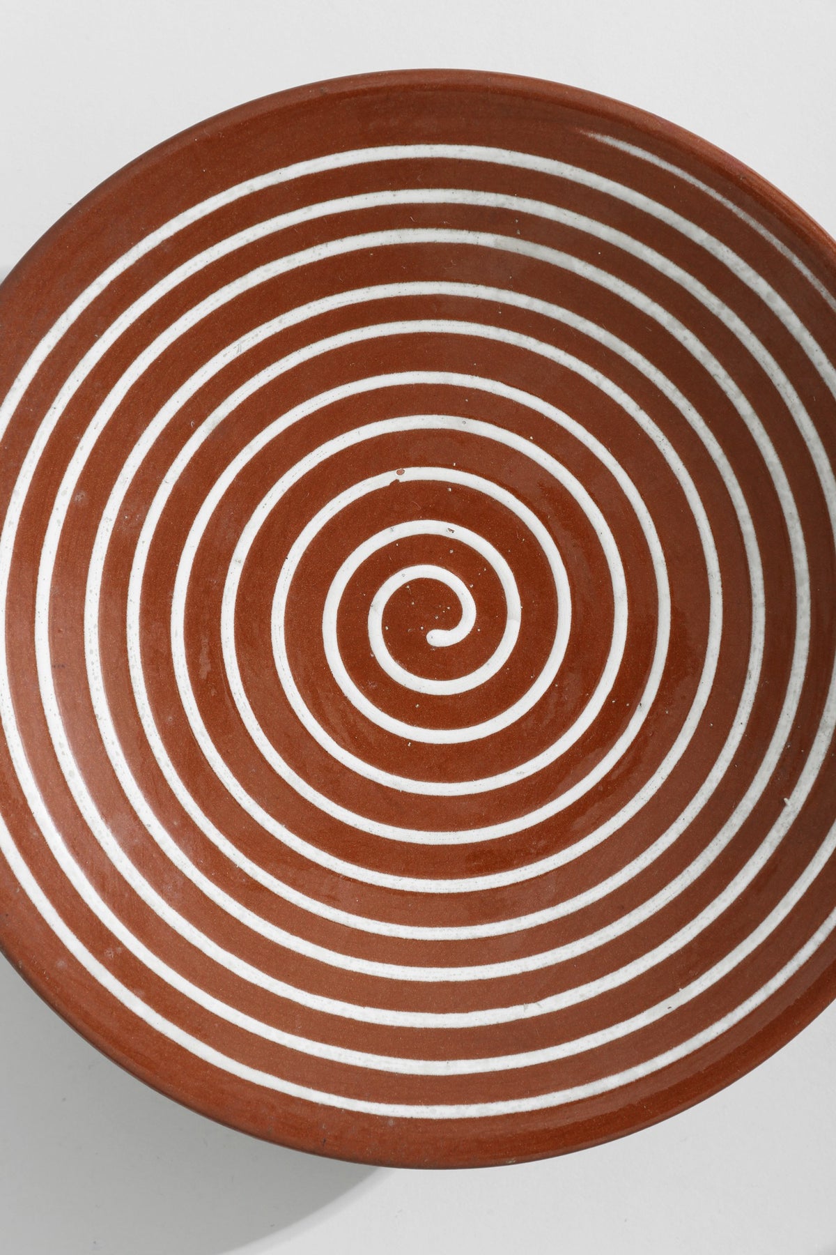 Spiral Pedestal Pottery Bowl — top view of terracotta with white stripes