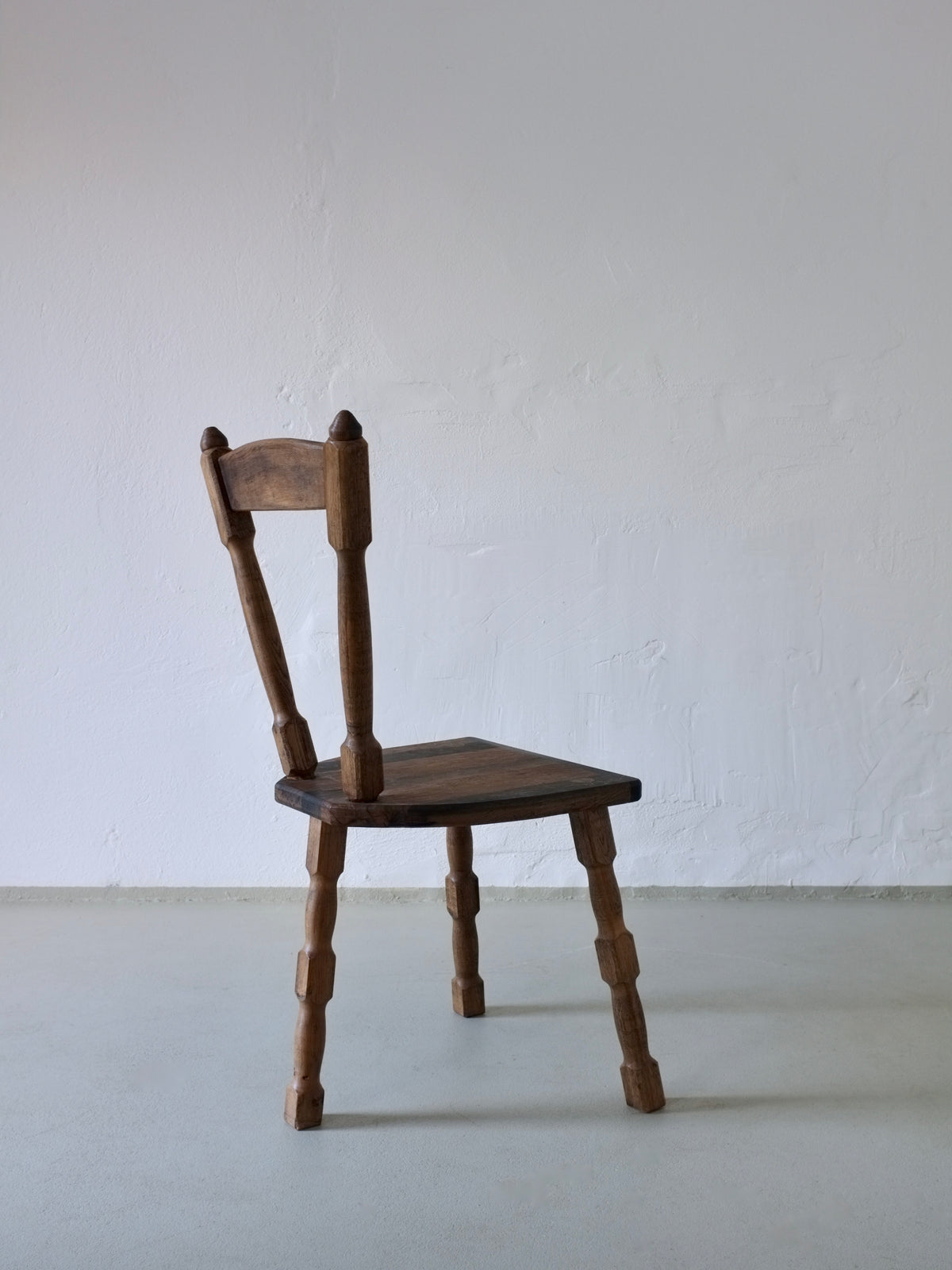Brutalist sculptural wooden dining chair side view 1970s