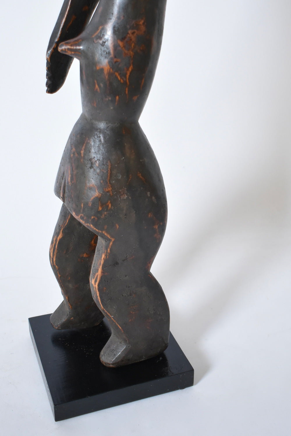 Anthropomorphic African Wooden Sculpture — side view highlighting dark wood finish