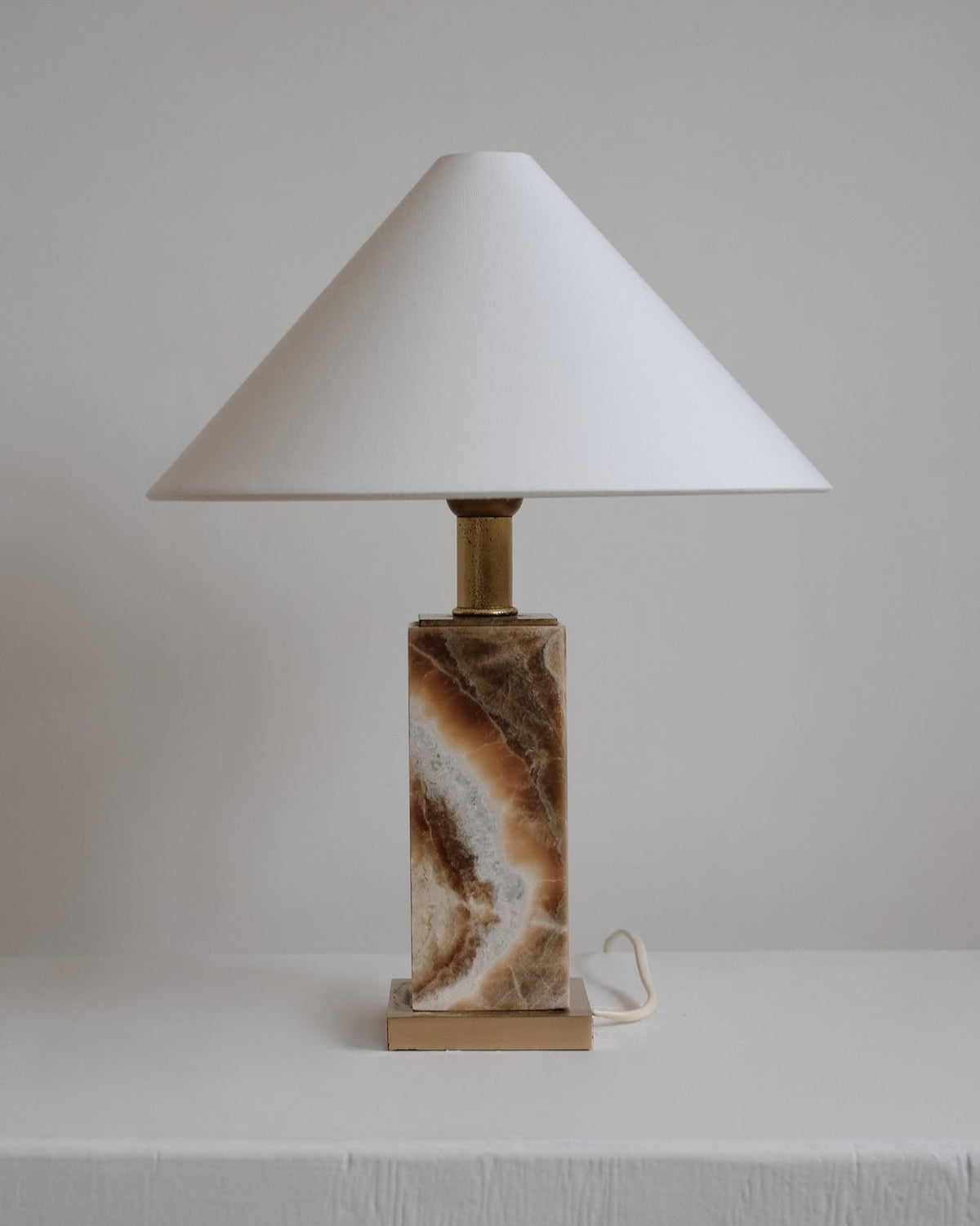 Onyx Table Lamp — side angle showing natural stone base and white shade