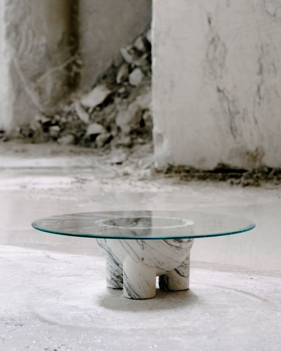 Modern glass coffee table with twisted Arabescato marble base