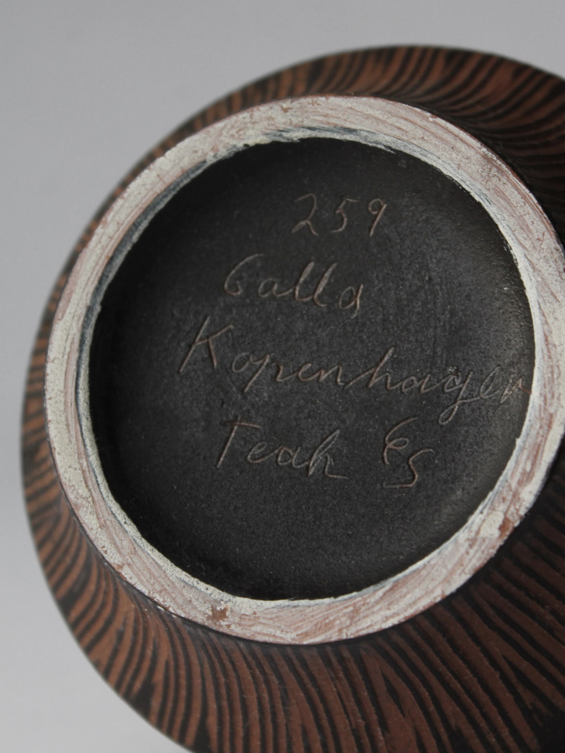 Bottom view showing Gallo ceramic jug maker's mark and teak finish