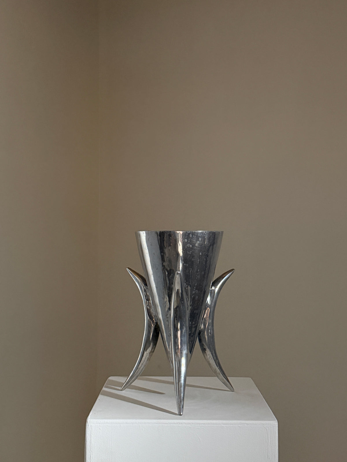 Large cast aluminum tripod vase, France, 1970 — side angle