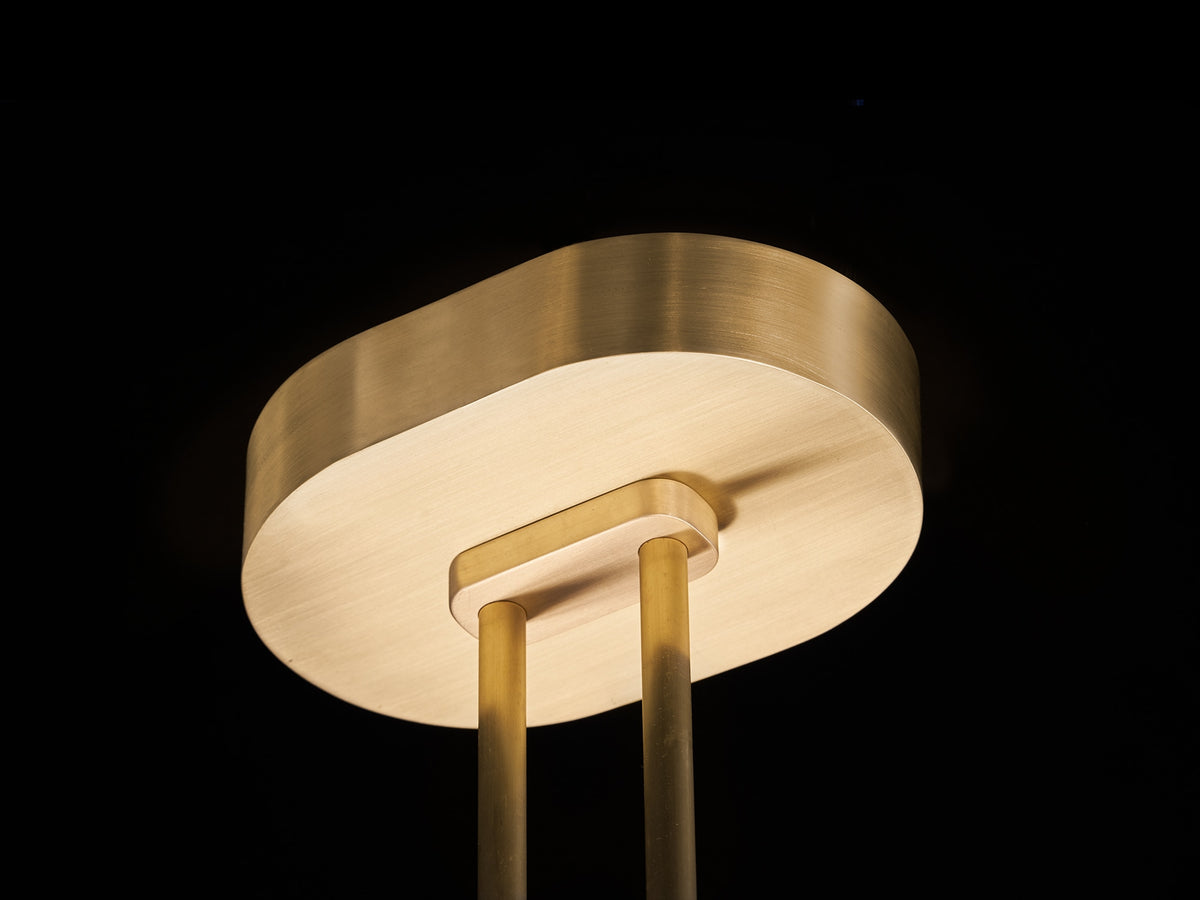 Brass pendant lamp ceiling mount detail showing rounded canopy and posts
