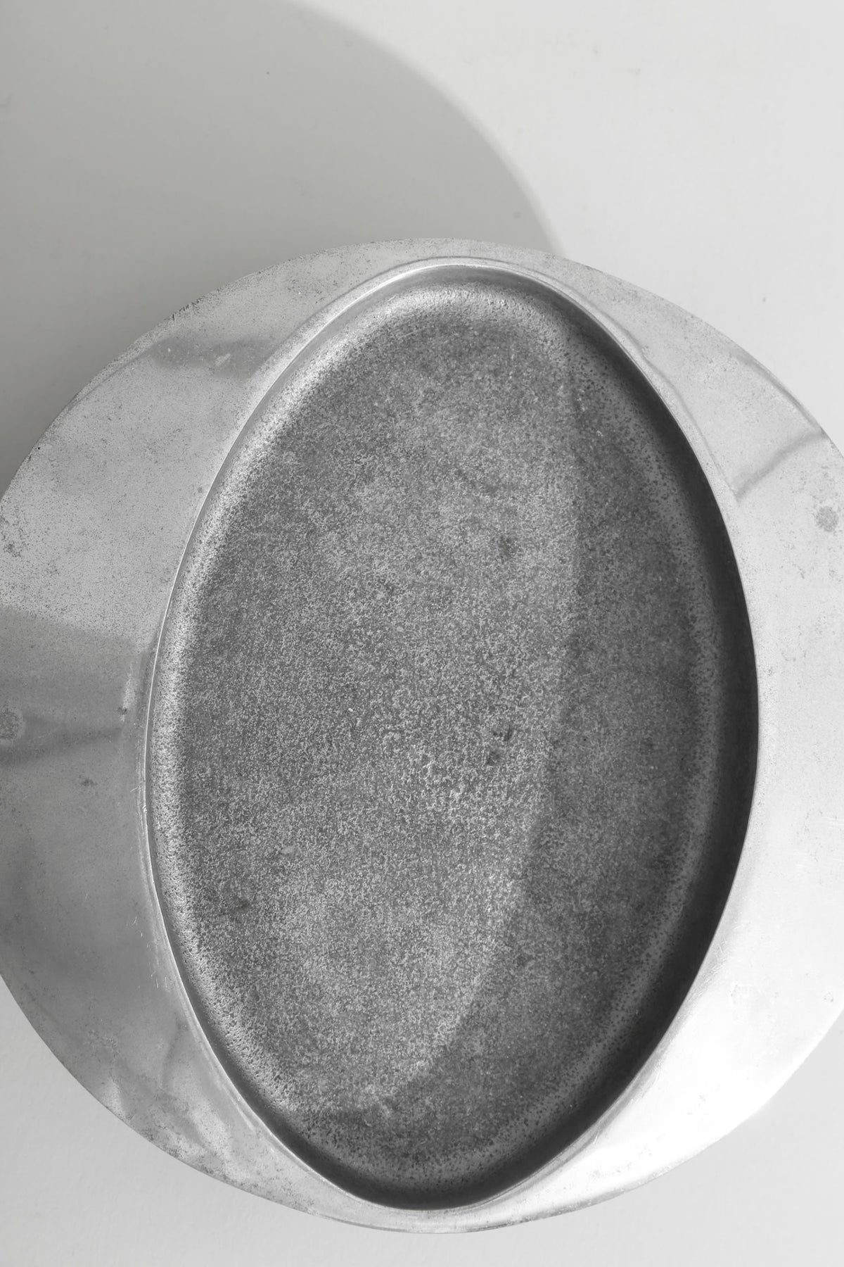 Brutalist Chrome Catchall — top view of textured chrome surface