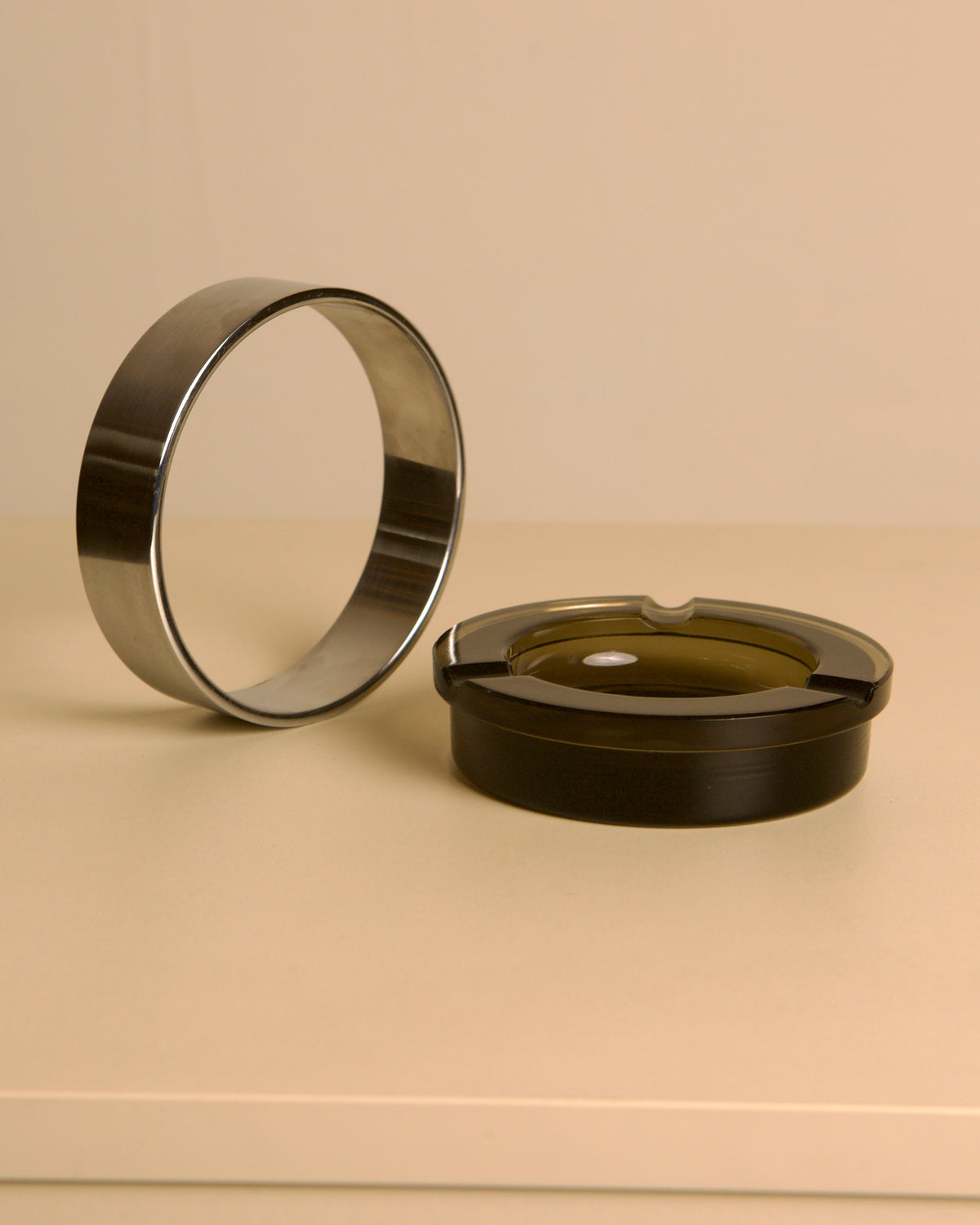 Italian circular metal and amber glass ashtray, 1970s — lifestyle setting