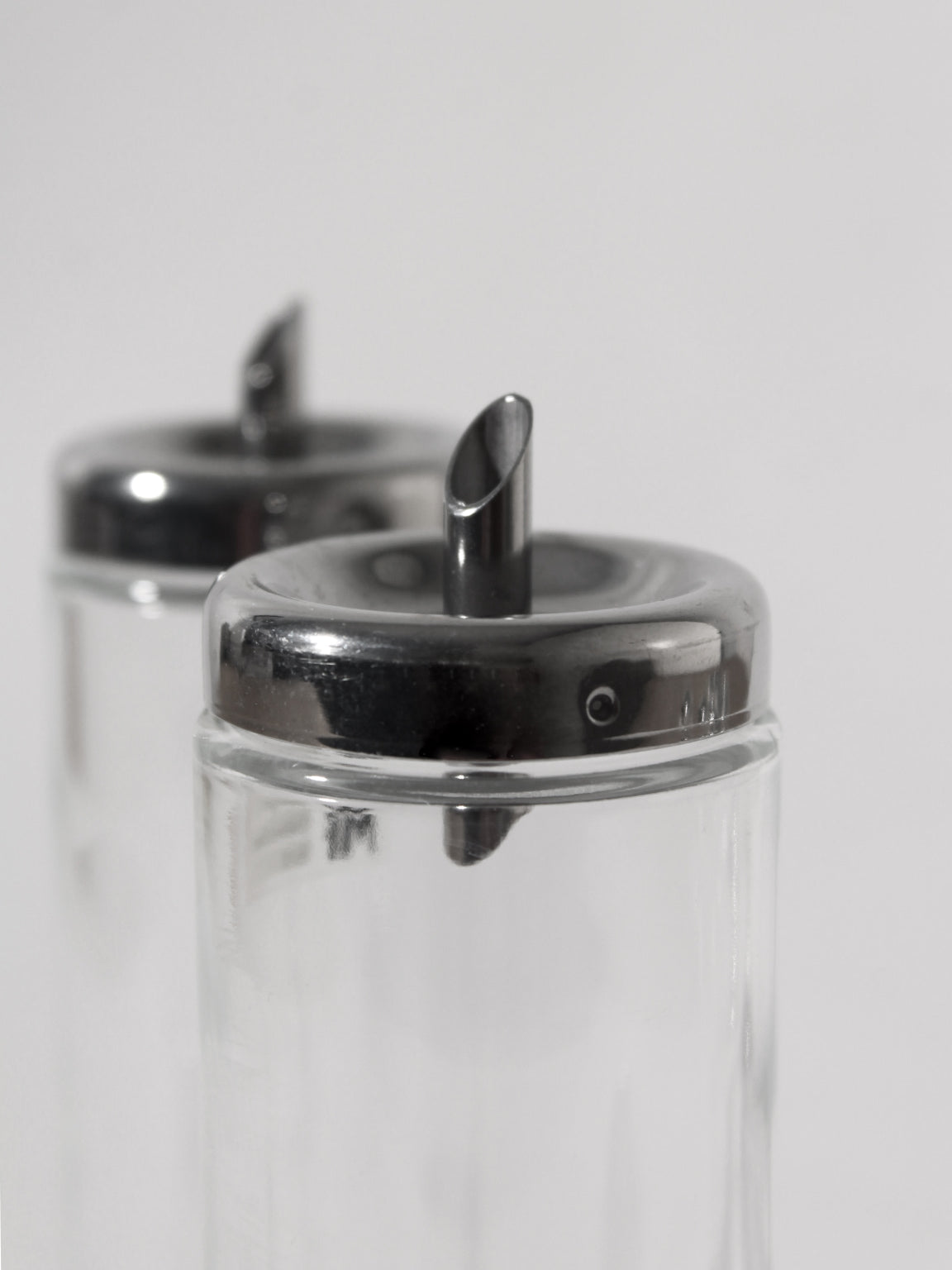 Stainless Steel Memphis Set by Matteo Thun for WMF Germany, 1980s — close-up of glass containers with metal tops