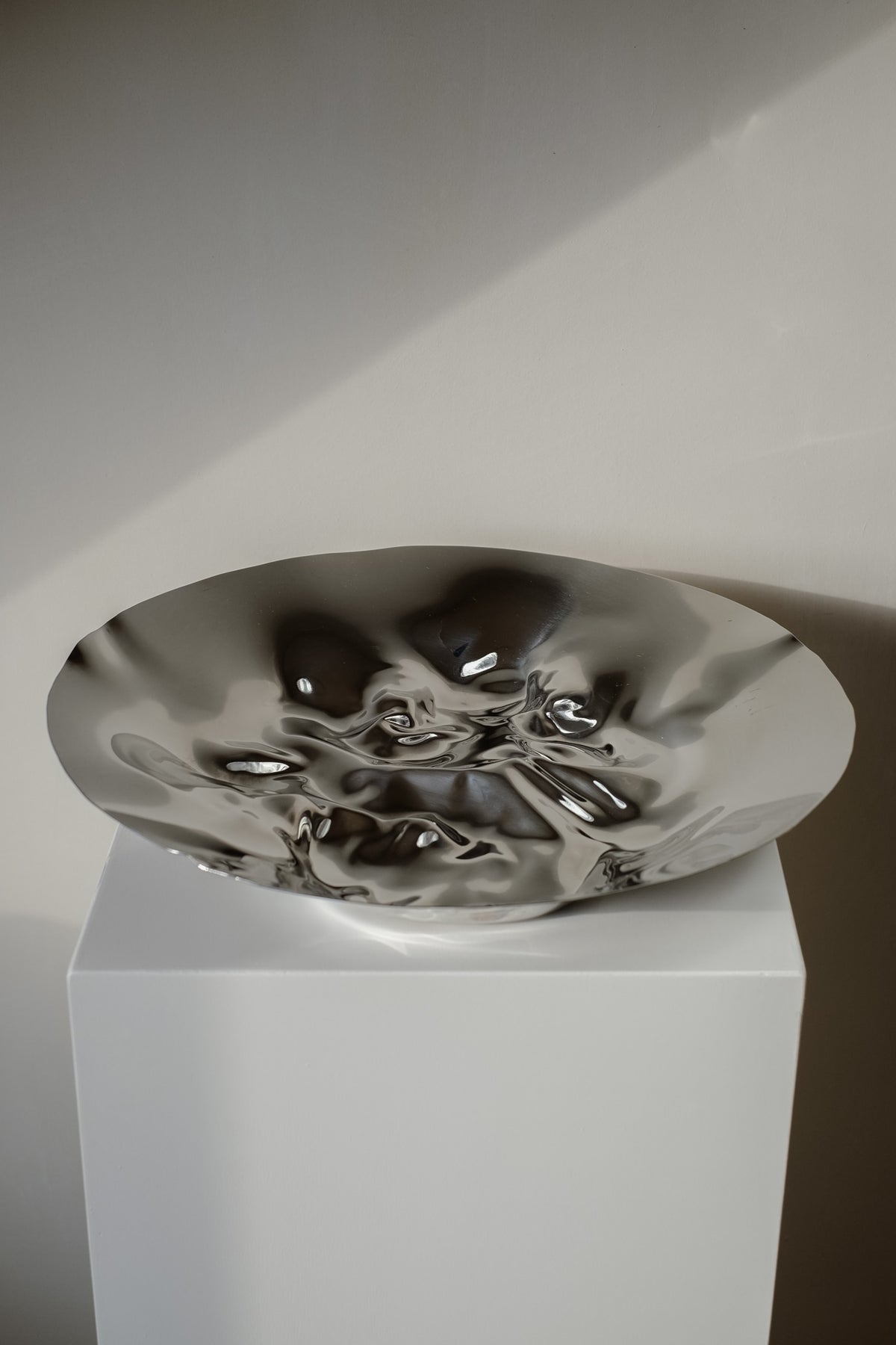 Chrome Curved Decorative Bowl — back view of polished chrome surface