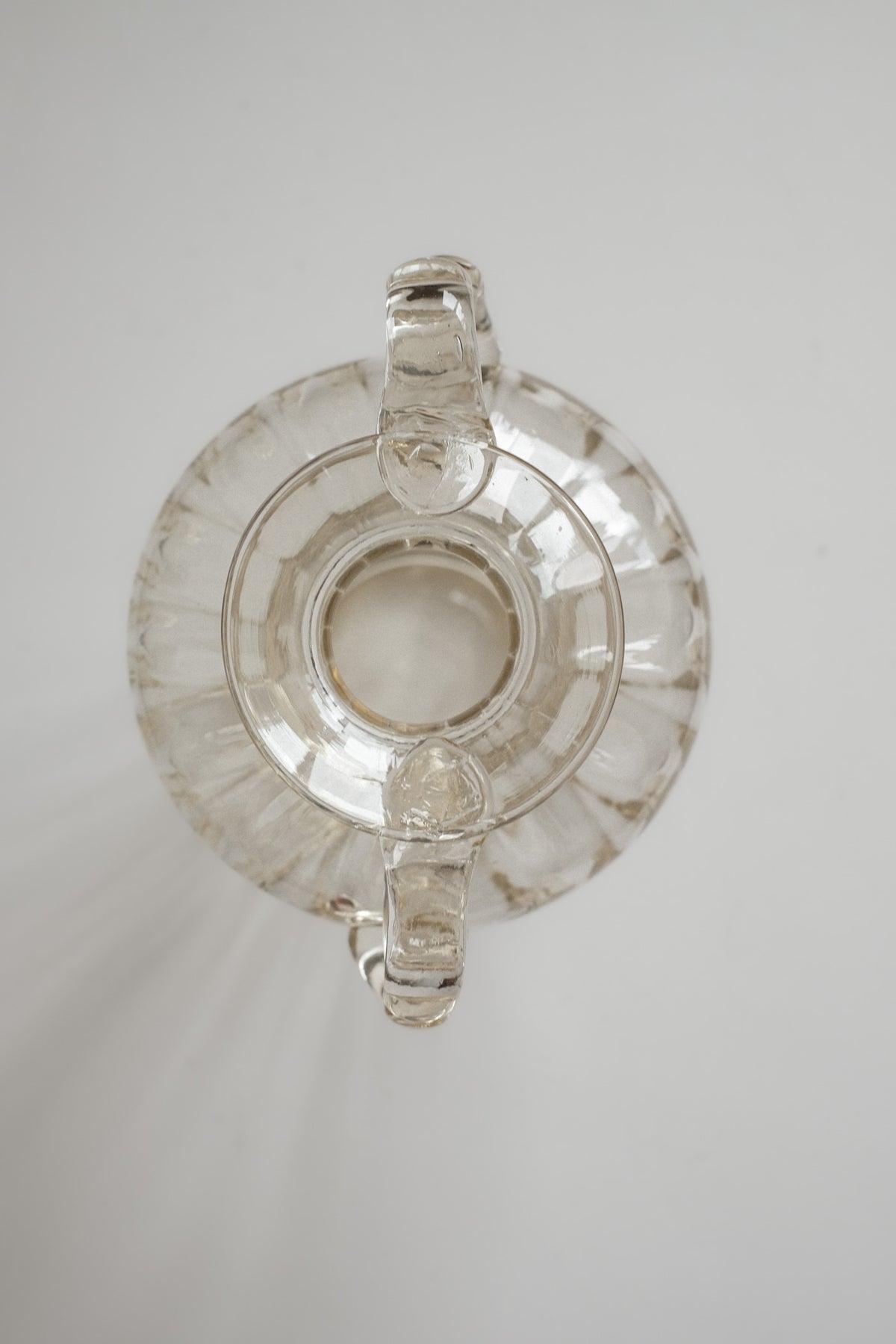 Elegant Handcrafted Glass Vase with Decorative Handles — in context