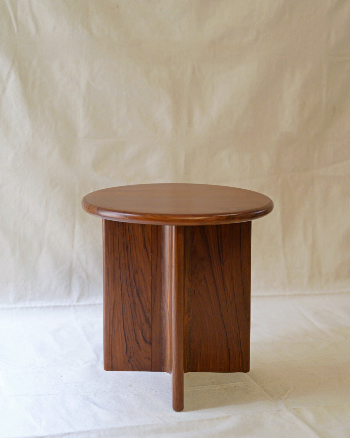 Round walnut Dory side table with cylindrical base by Studio Indigene