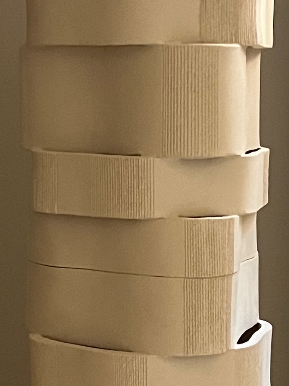 Stacked ceramic segments detail of Too 60 floor lamp