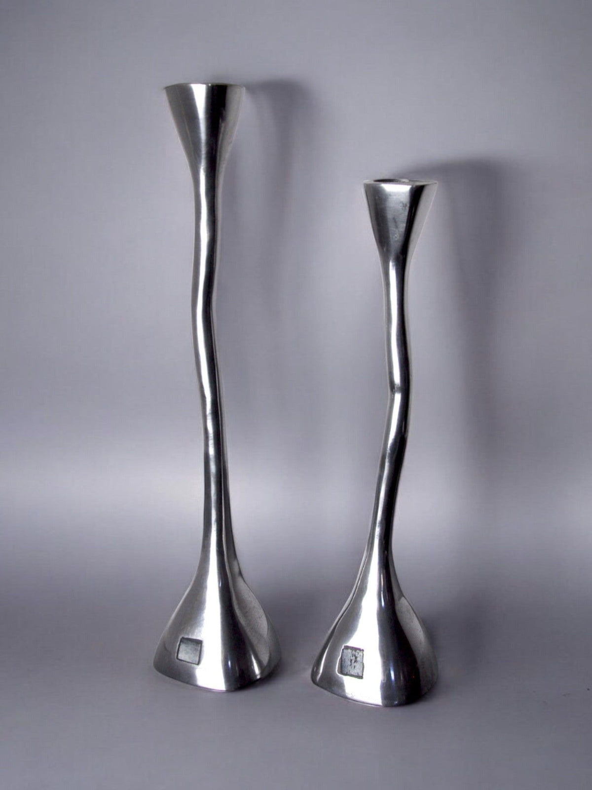 Pair of Candleholders, art3, Spain, 1970s — close-up of polished metal finish