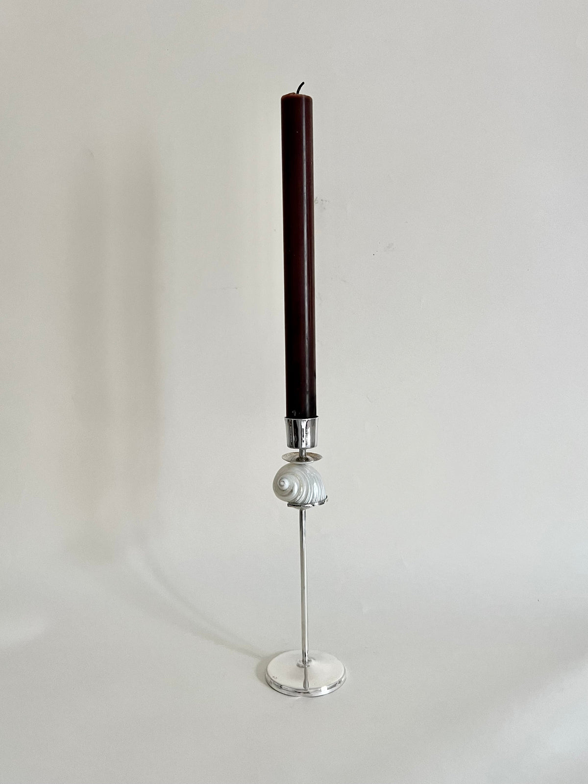 Silver Spiral Candleholder — top view with dark candle on silver base
