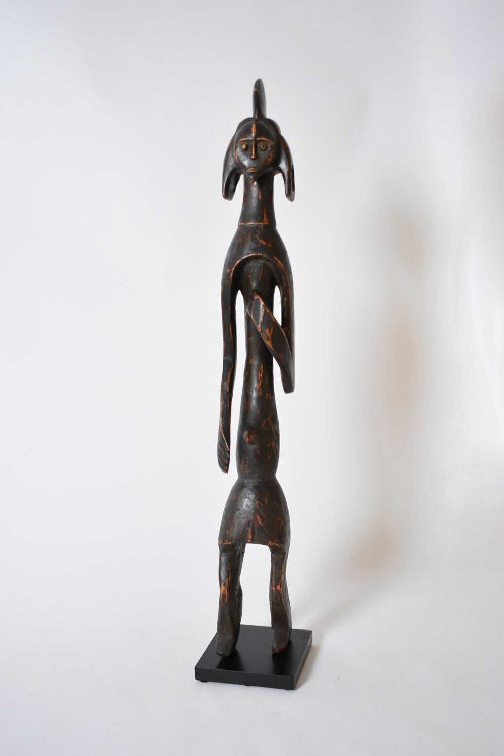 Anthropomorphic African Wooden Sculpture — side angle highlighting dark wood finish