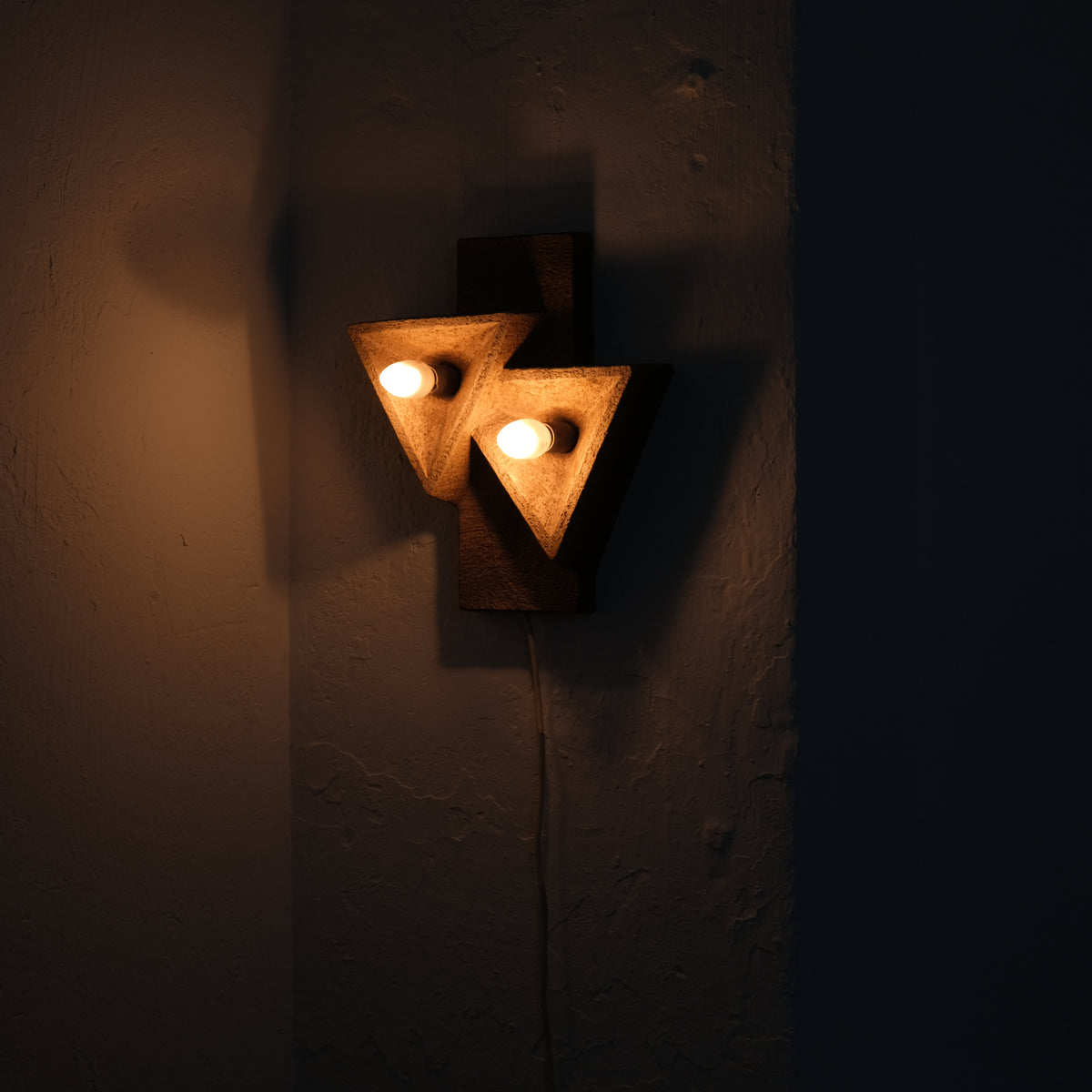 Dutch Organic Form Ceramic Wall Sconce, 1960s — back view with warm light glow