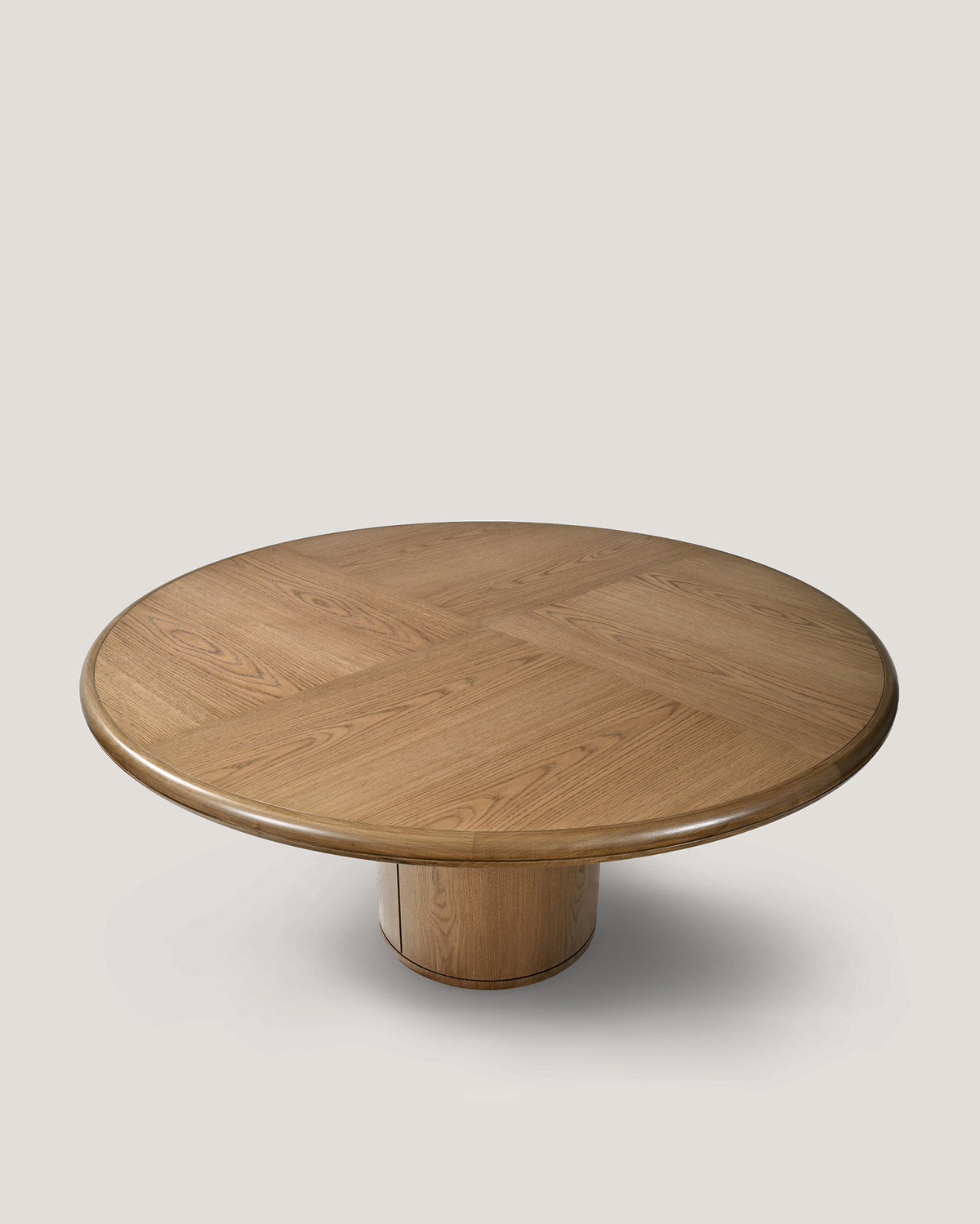 Moon round dining table in natural oak with cylindrical pedestal base