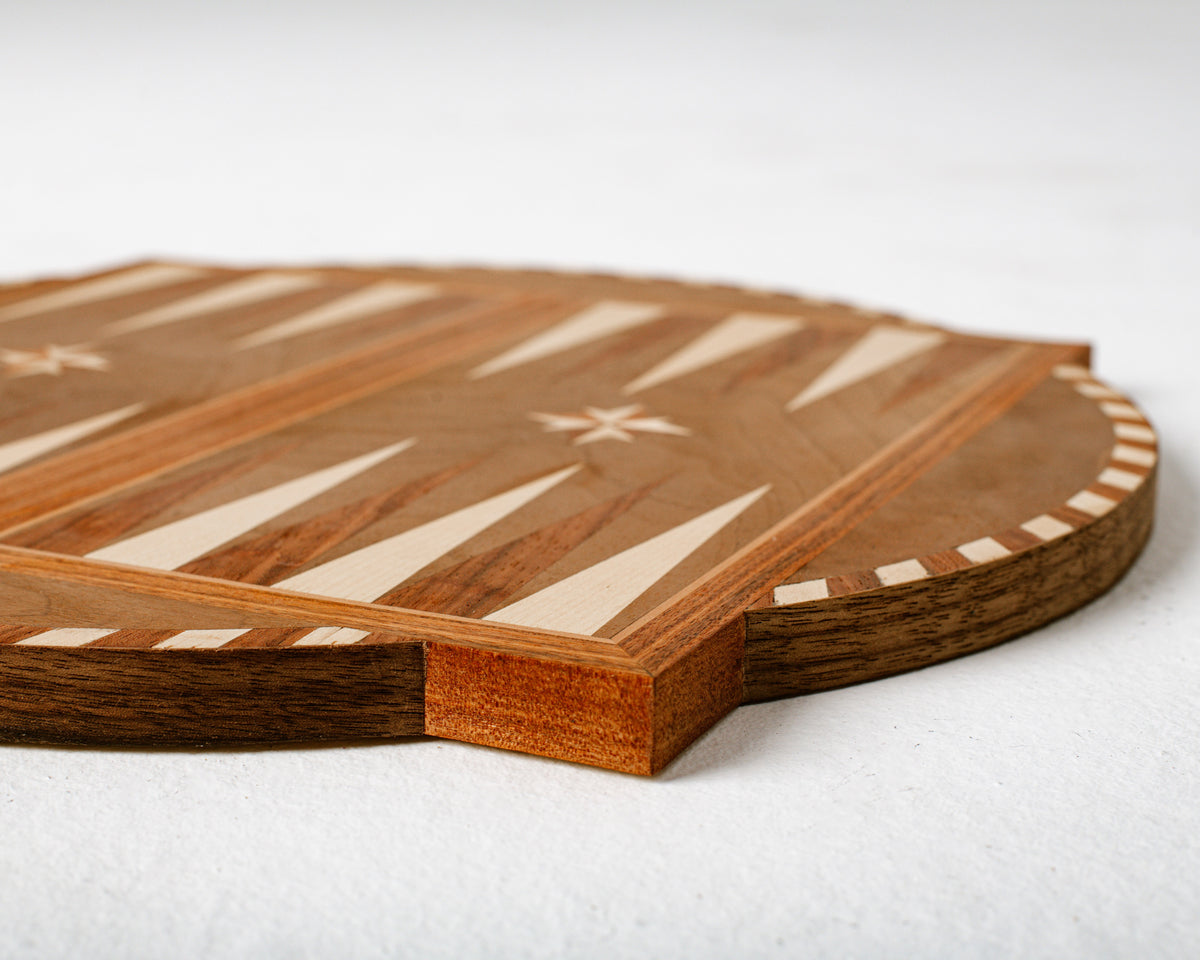 Close-up detail of Navigator backgammon board with wooden inlays